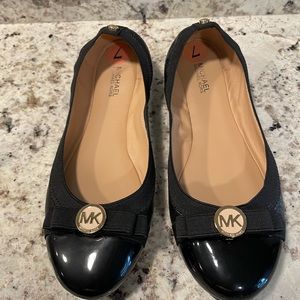 Michael Kors black ballet style slip on shoes.